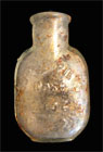 small glass patent medicine bottle